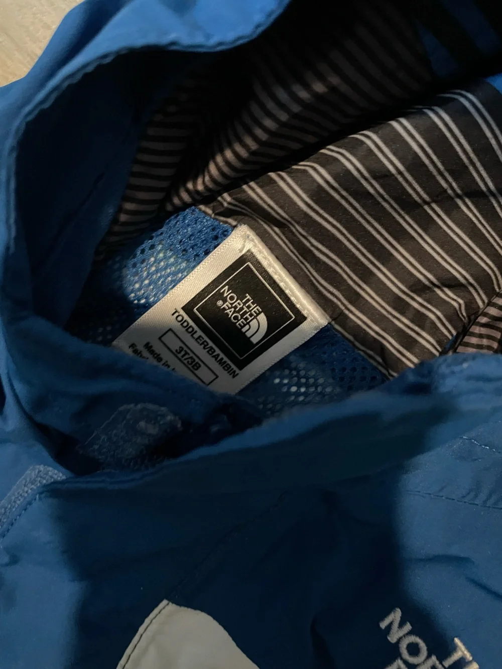 The North Face Kids Blue, Gray & White Hooded Rain Jacket